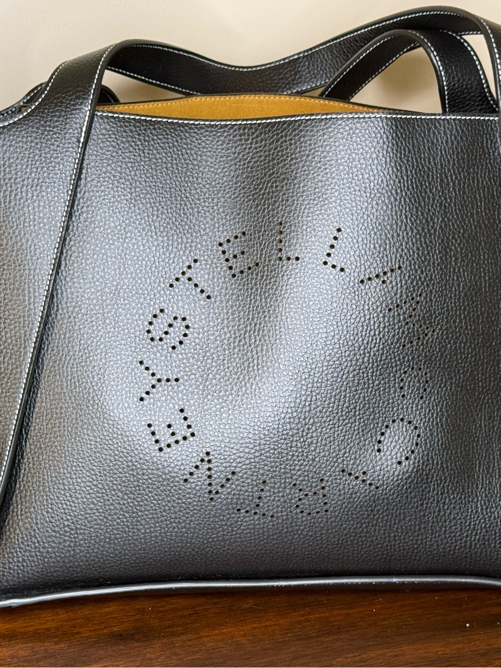Stella McCartney Black Vegan Leather Perforated Logo Tote with Mustard Interior - Picture 12 of 12